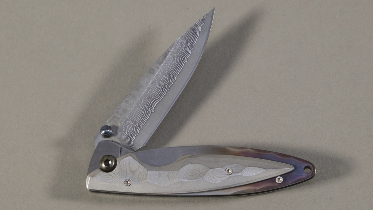 Couteau japonais pliant Mcusta Kasumi - manche 9,5 cm acier VG-10 damas inox 66 couches
